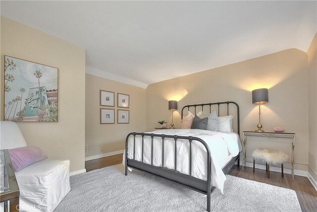 bedroom with hardwood / wood-style flooring