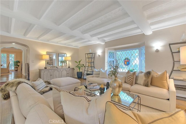 living room featuring beamed ceiling, light wood-type flooring, and coffered ceiling