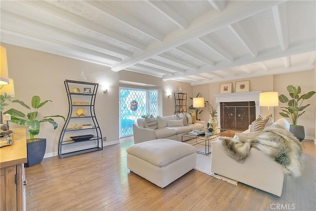 living room featuring hardwood / wood-style floors and beamed ceiling