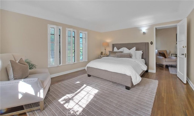 bedroom with hardwood / wood-style floors