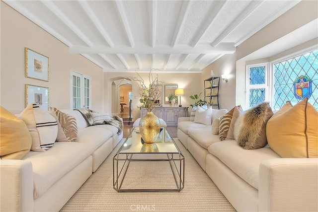 living room with beamed ceiling