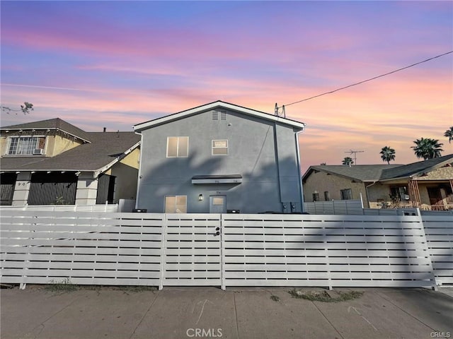 view of property exterior at dusk