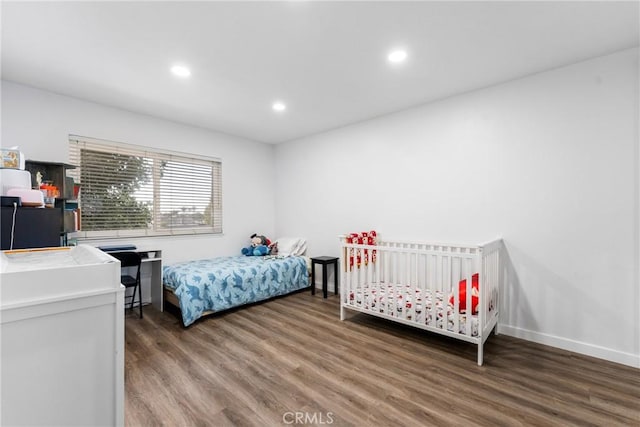 bedroom with wood-type flooring