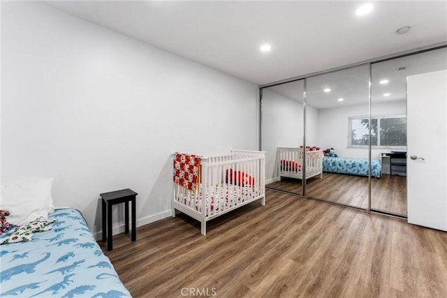 bedroom featuring a closet and hardwood / wood-style flooring