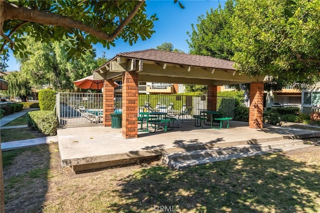 view of community with a gazebo and a yard