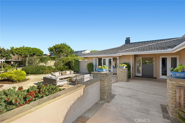 view of patio featuring french doors and an outdoor hangout area