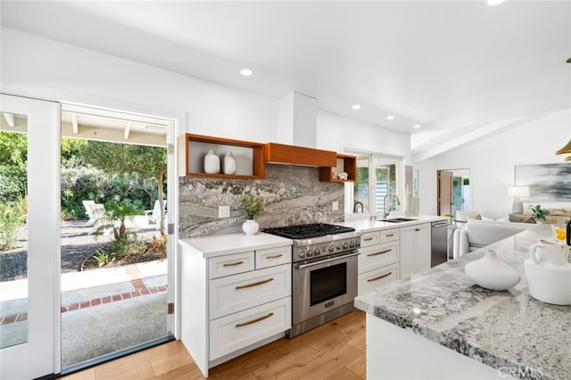 kitchen featuring white cabinets, light hardwood / wood-style floors, sink, and appliances with stainless steel finishes