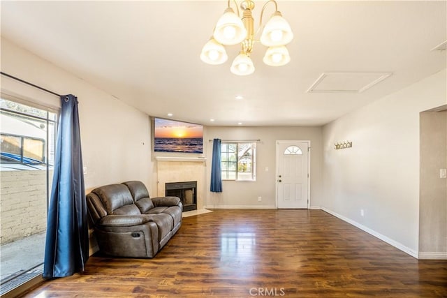 living room featuring dark hardwood / wood-style flooring and a chandelier