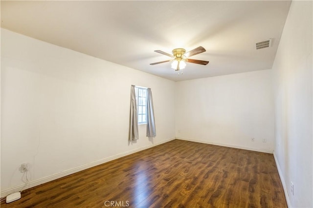 unfurnished room featuring dark hardwood / wood-style floors and ceiling fan