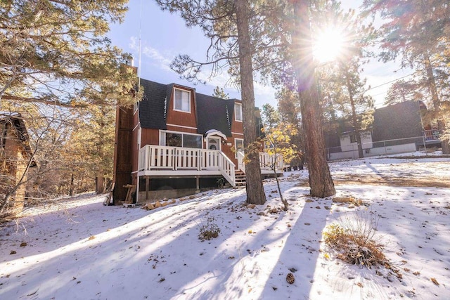 front of property featuring a deck