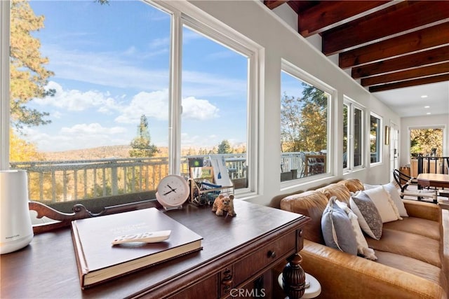 sunroom / solarium with plenty of natural light and beamed ceiling