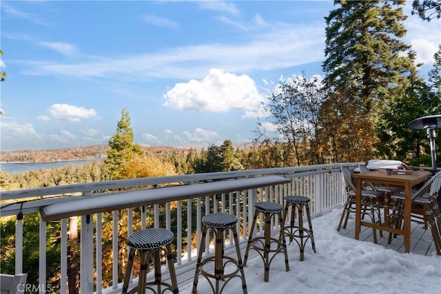 wooden terrace with a water view