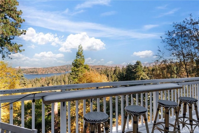 balcony featuring a water view