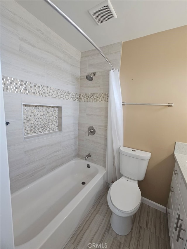 full bathroom featuring vanity, shower / bath combination with curtain, and toilet