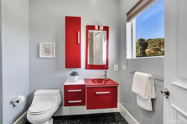 bathroom with vanity and toilet