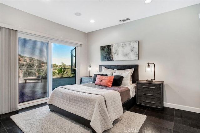 bedroom with access to outside and dark hardwood / wood-style flooring