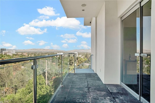 balcony featuring a mountain view