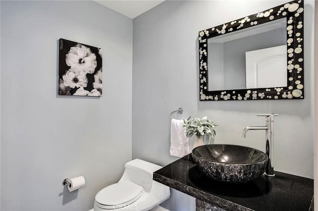 bathroom featuring sink and toilet