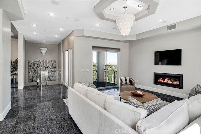 living room featuring a notable chandelier