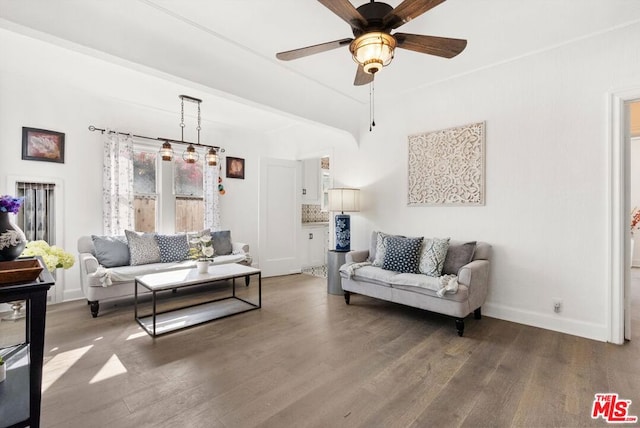 living room with dark hardwood / wood-style floors and ceiling fan