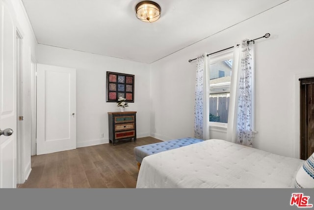 bedroom featuring hardwood / wood-style floors