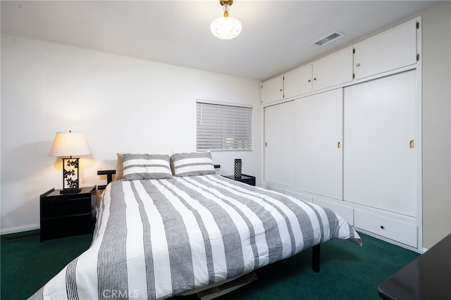 carpeted bedroom featuring a closet