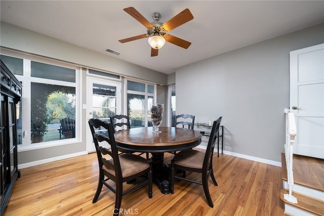 dining area featuring light wood-type flooring and ceiling fan