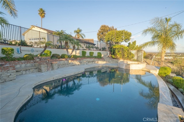 view of swimming pool featuring a patio