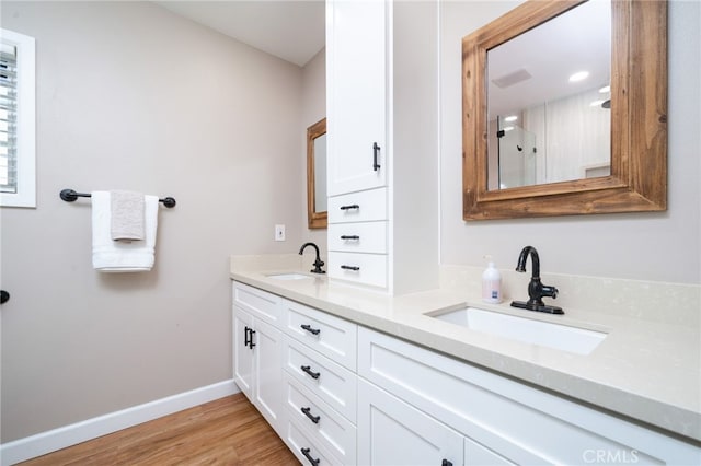 bathroom featuring wood-type flooring and vanity