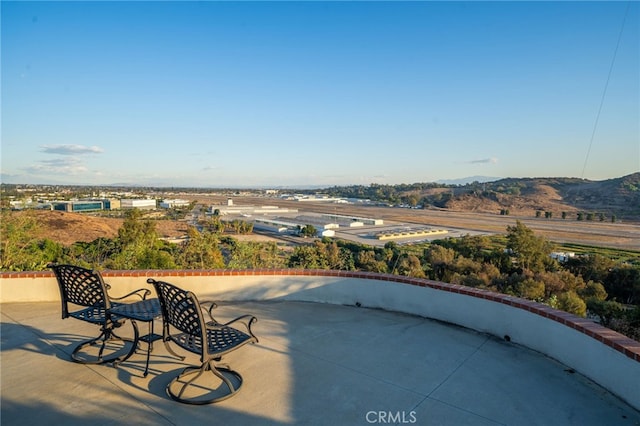 view of patio / terrace with a mountain view