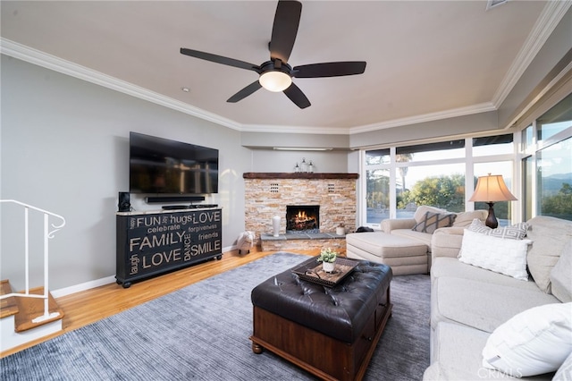 living room with a fireplace, hardwood / wood-style floors, ceiling fan, and crown molding