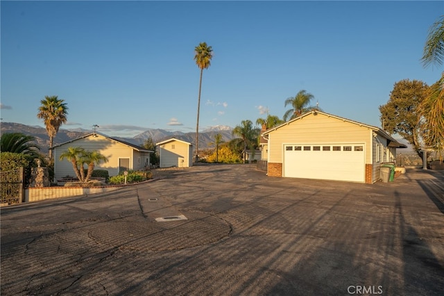 ranch-style house featuring a mountain view and a garage