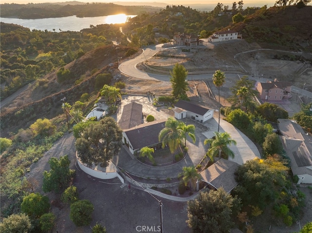 aerial view at dusk with a water view