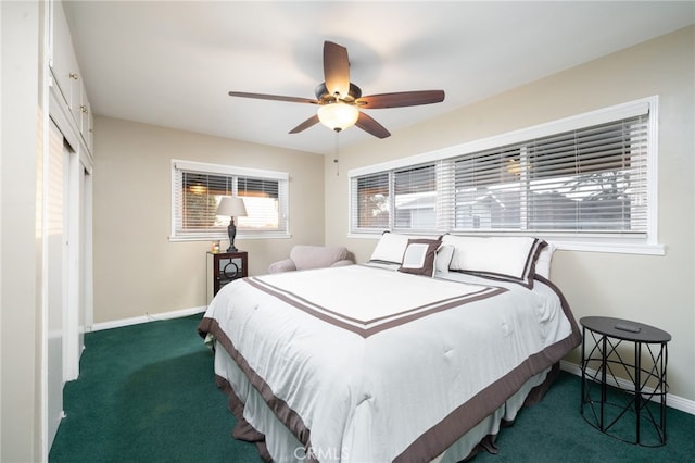 bedroom featuring ceiling fan and dark carpet