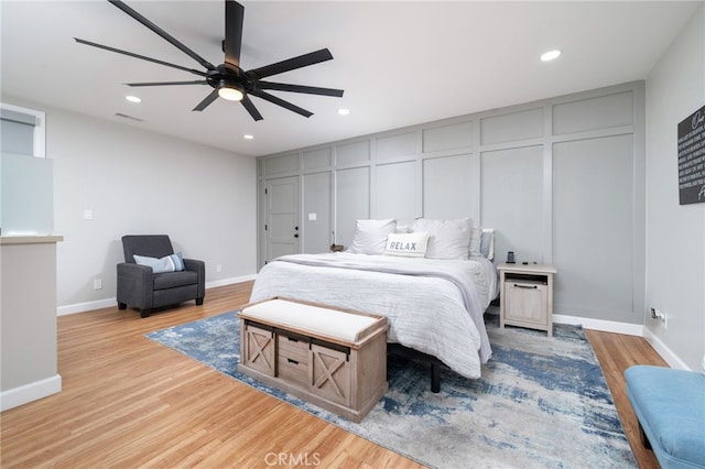 bedroom featuring ceiling fan and light hardwood / wood-style floors