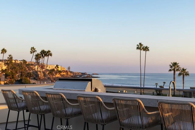 patio terrace at dusk with a water view