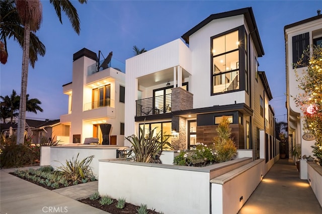 contemporary home featuring a balcony