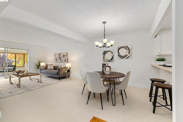 carpeted dining area featuring a notable chandelier and beam ceiling