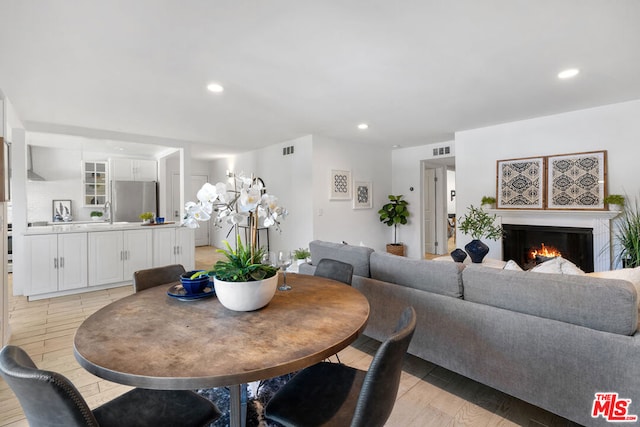 dining space featuring light hardwood / wood-style floors