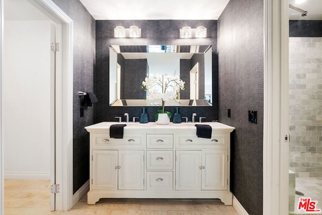 bathroom with hardwood / wood-style floors and vanity