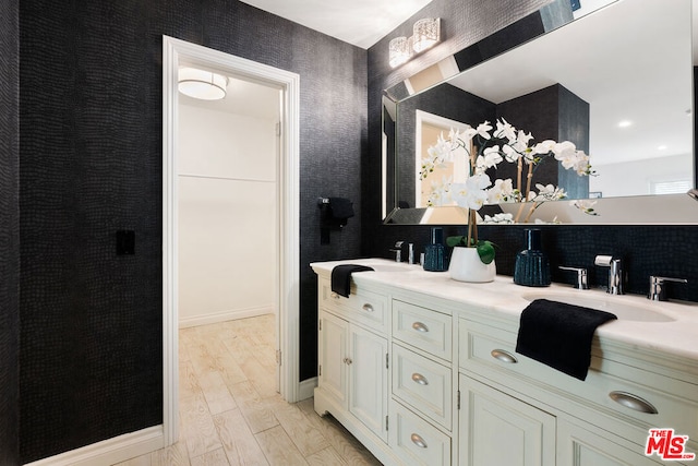 bathroom with vanity and hardwood / wood-style flooring