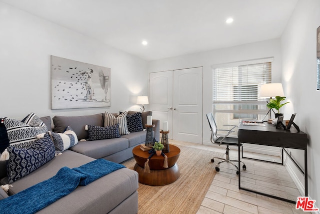 office area with light hardwood / wood-style floors