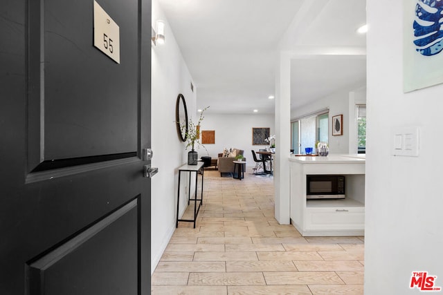 hallway with light wood-type flooring