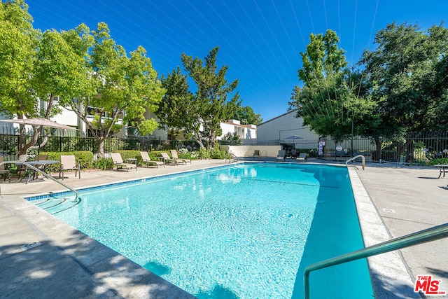 view of pool featuring a patio