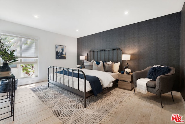 bedroom with light wood-type flooring