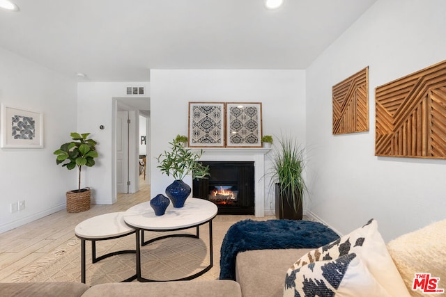 living room with light hardwood / wood-style floors