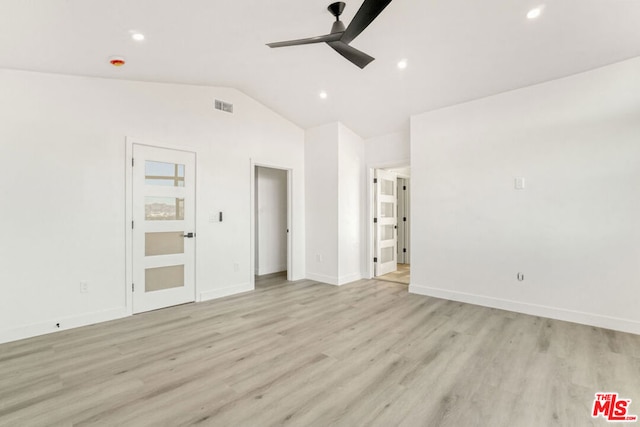 unfurnished room featuring ceiling fan, light hardwood / wood-style floors, and lofted ceiling