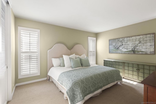 carpeted bedroom featuring a closet