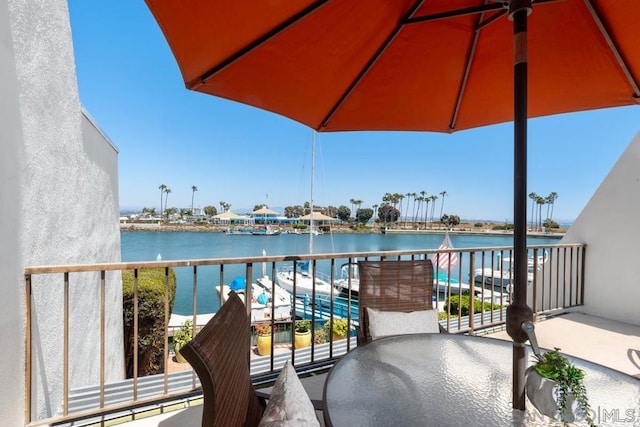 balcony featuring a water view