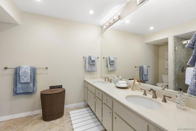 bathroom featuring tile patterned flooring, vanity, and toilet